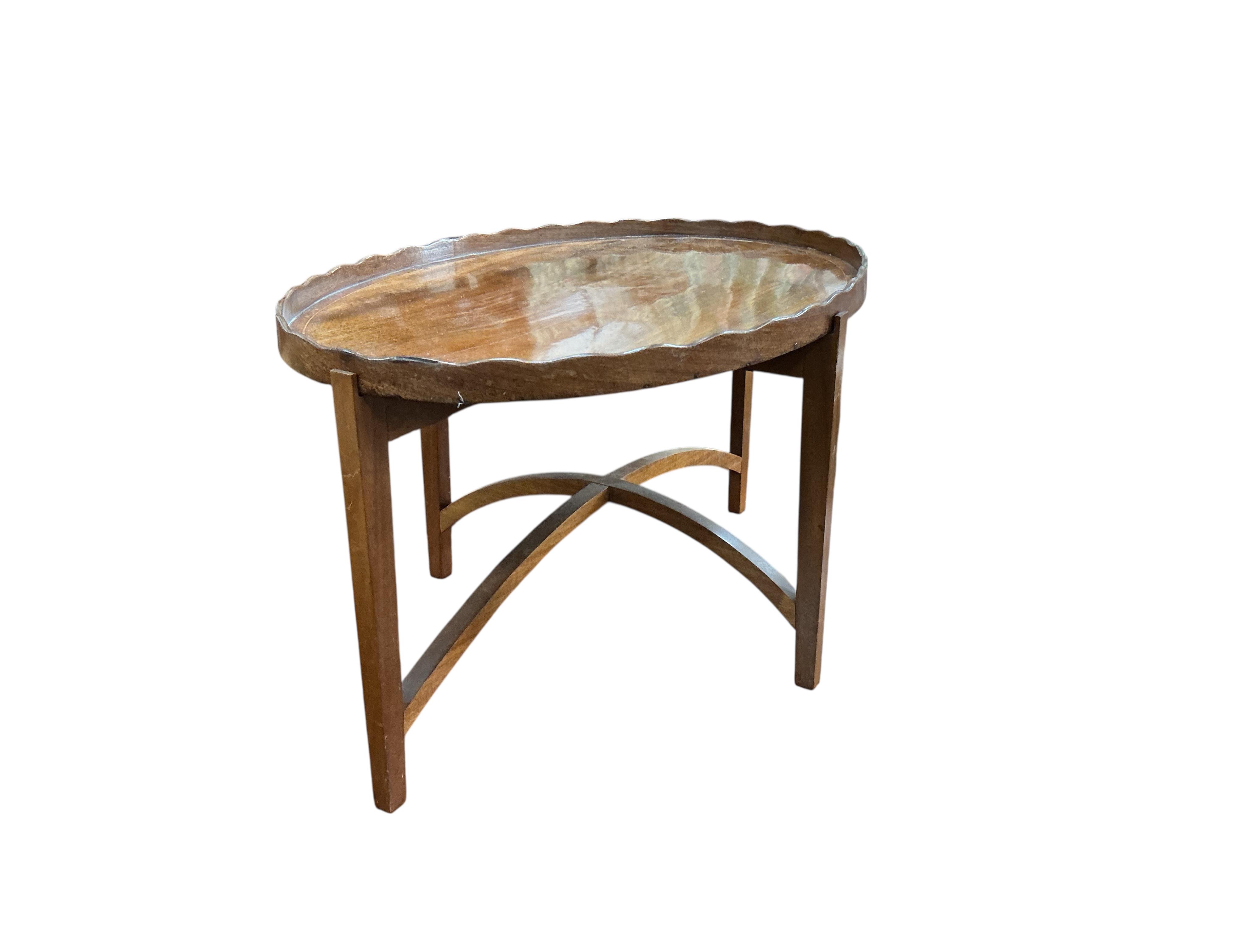 A George III oval mahogany tray on later 'X' framed stand, width 48cm, depth 39cm, height 33cm